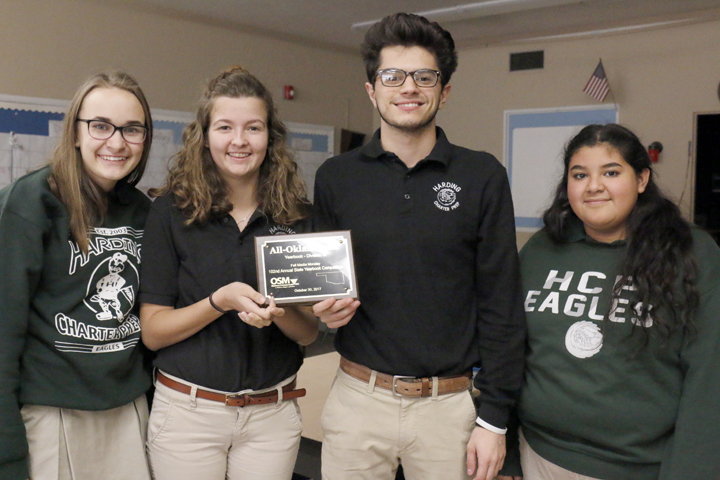 Madison+Ellis%2C+Karissa+Henning%2C+Arian+Farkhoy+and+Janeth+Rivera+show+off+their+All-Oklahoman+plaque+from+the+Oklahoma+Scholastic+Media%2C+which+they+won+for+their+work+on+the+2017+Aquila+yearbook.