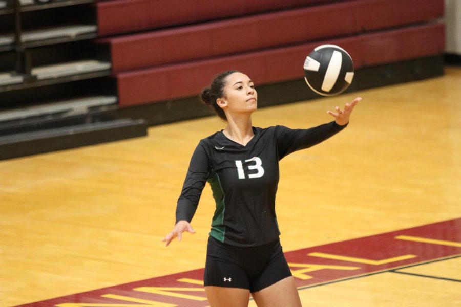 Senior+Emily+Popielec+serves+the+ball+in+a+game+against+Seminole+Charter+on+Sept.+3.