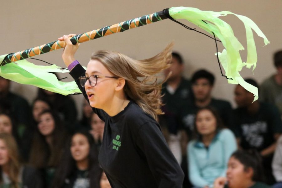 Senior+Katelynn+Solf+runs+with+the+spirit+stick+at+the+Spirit+Week+assembly.
