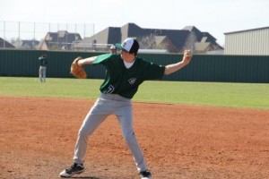 Carus Newman pitches